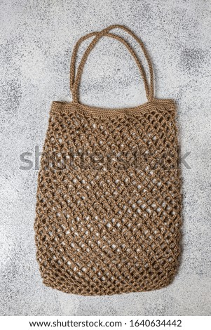 Eco-friendly knit bag for environmentally conscious people. Made from natural hemp thread. The concept of a healthy lifestyle. Biodegradable. Handmade.