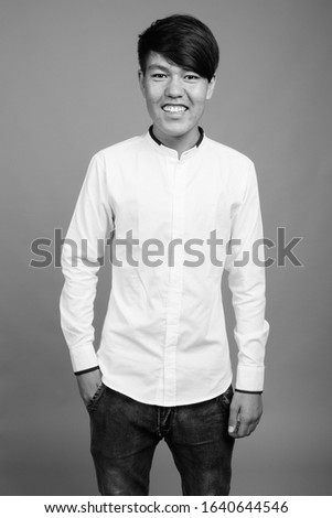 Young Asian teenage boy wearing smart casual clothes
