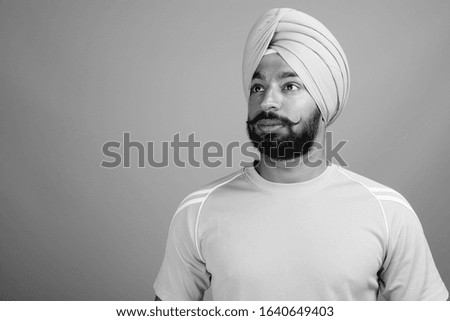 Young bearded Indian Sikh man wearing turban