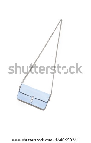 fashion light  blue leather female handbag isolated on white background
