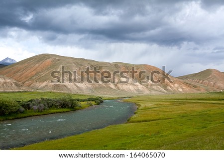 River in mountains in rainy day, Tien Shan, Kyrgyzstan
