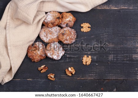 Homemade pastries, cookies on a wooden dark background