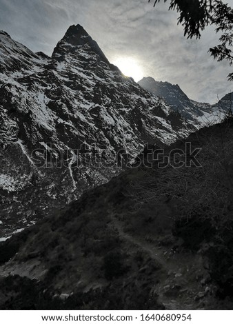 Sun hidden by mountain. Photos from a trek to Everest Base Camp, Nepal, spring 2019.