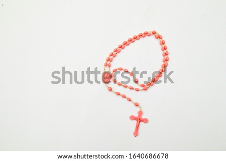 catholic rosary beads isolated in white background