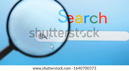 Internet browser search bar with Magnifying Glass on computer screen with text Search