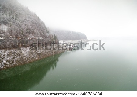 Winter snowy day in Bicaz Lake side at Mount Izvorul Dam, located in Piatra Neant, Romania