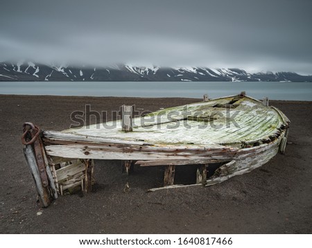 old broken wooden whalers boat on the beach