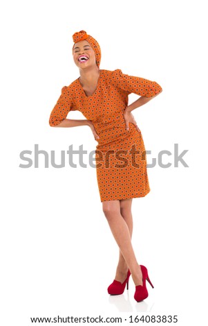 laughing young african woman in traditional clothes 