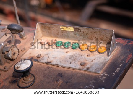 Row of color lighting sign (bulb) of engine control panel which is use for pumping unit in oil field industry. Industrial equipment object, close-up and selective focus photo.