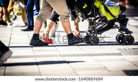 people cycling and walking on sidewalk 
