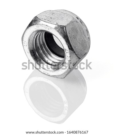 Old and dirty steel nut isolated on white background and reflective