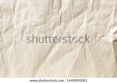 Crumpled brown paper background texture
