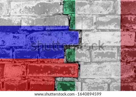 Russia Federation and Italy - National flags on Brick wall. Governments relations and conflict concept.