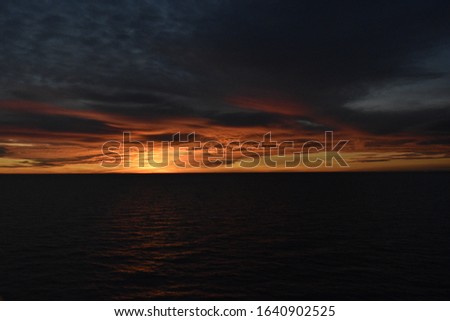 Beautiful cloudy sunset in the sea