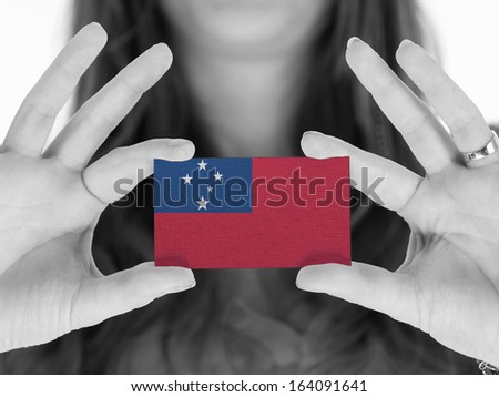 Woman showing a business card, flag of Samoa