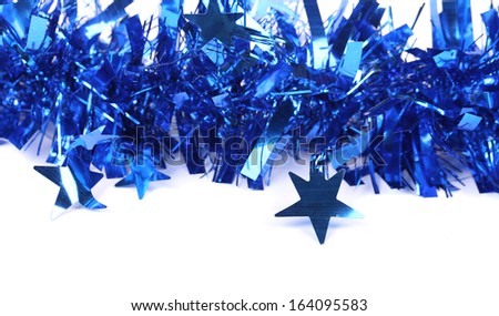 Christmas blue tinsel with stars. There is white space for text
