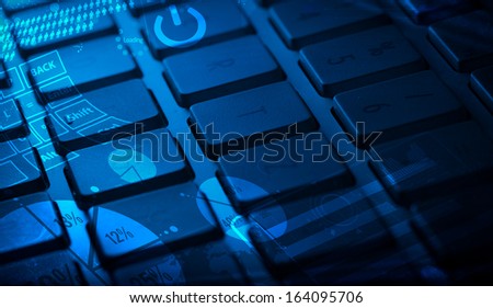 Computer keyboard with glowing charts, digital marketing concept
