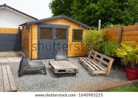 Small wooden cabin house exterior design Royalty-Free Stock Photo #1640983225