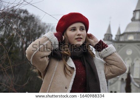 cute young girl on a background of the city