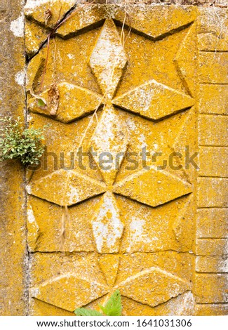 Vintage ornament on the wall of a medieval church