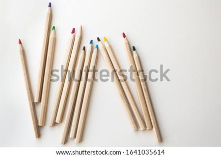 Wooden colorful ordinary pencils on a white background.