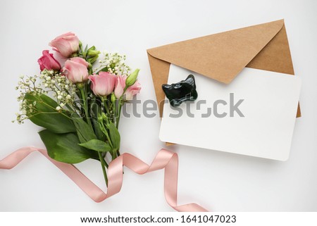 greeting card design. wedding invitation. small bouquet of flowers on a white background, envelope. space for text