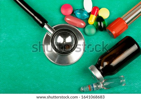 Picture of a colourful pills, capsules, stethoscope and pack of medicines