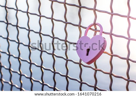 Pink heart. Metal lock Valentines day background. Concept of love, romantic relationship and fidelity. Copy space for your text Royalty-Free Stock Photo #1641070216