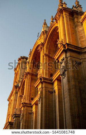Sunset view of the ain facade of the Granada Cathedral, or Cathedral of the Incarnation Royalty-Free Stock Photo #1641081748