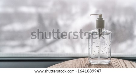 Coronavirus hand sanitizer gel to wash hands for flu virus prevention. Alcohol based antimicrobial disinfectant product for airport, hospital, healthcare and home panoramic banner background. Royalty-Free Stock Photo #1641089947