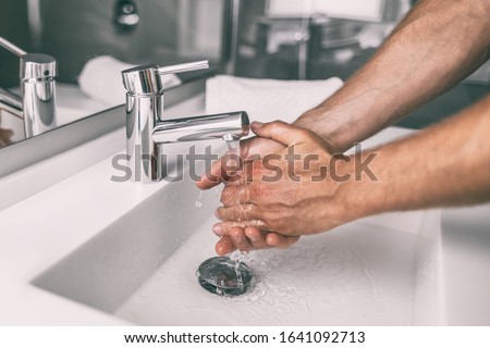 Washing hands rubbing with soap man for winter flu virus prevention, hygiene to stop spreading germs. Royalty-Free Stock Photo #1641092713