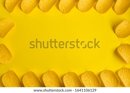 Banner, Copy space, Delicious potato chips on yellow background, Junk food, fast snack, crisps, Top view