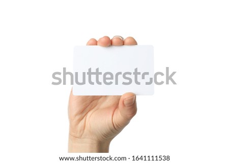 Female hand holding blank business card, isolated on white background