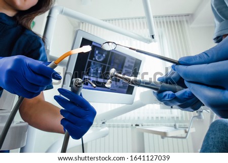 Closeup photo, dentistry  equipment in hands.