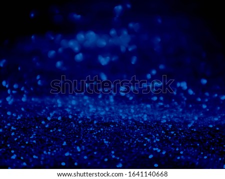 Blue bokeh abstract background.Blurred bright light.