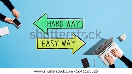 Hard way or easy way with people working together with laptop and phone
