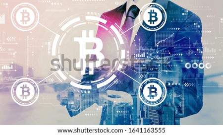 Bitcoin theme with businessman holding a tablet computer