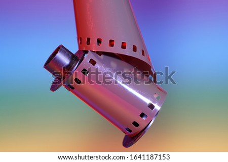 Film of an analogue camera with colorful background photographed in the studio                             