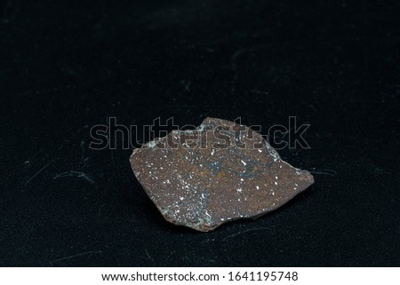 Inside slice of Chondrite Meteorite L Type isolated, piece of rock formed in outer space in the early stages of Solar System as asteroids. This meteorite comes from an asteroid fall at Atacama Desert