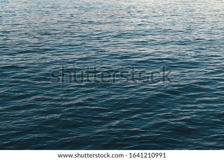 Texture surface of the dark blue sea