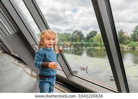 Toddler girl in front of window – Gelsenkirchen, Germany