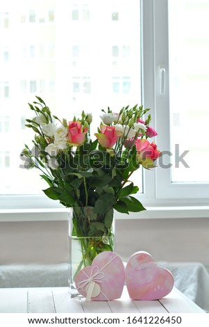 Spring card template. Happy Birthday or Valentine. Women's Day. Greeting card for mother's day. Congratulation with flowers. Copy space. Roses and Eustomas on window background. Selective focus