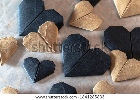 Close up view of origami hearts on a marble background. Valentine's day concept.
