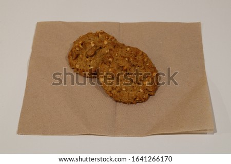 Peanut cookie on baking paper. Homemade Fresh Old fashion Macadamia Cookies with nuts. It has peanut butter and it is soft texture. It is served with coffee or Turkish tea. American pastry.