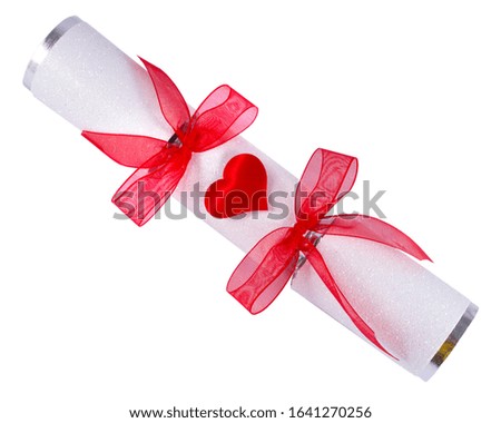 A beautiful Valentines Cracker, featuring a heart decoration and bows.