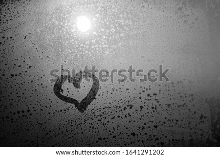Valentine's day blurred love heart on window