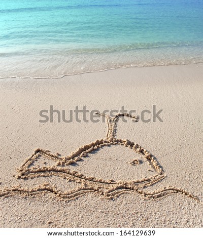 The whale - a picture on sand