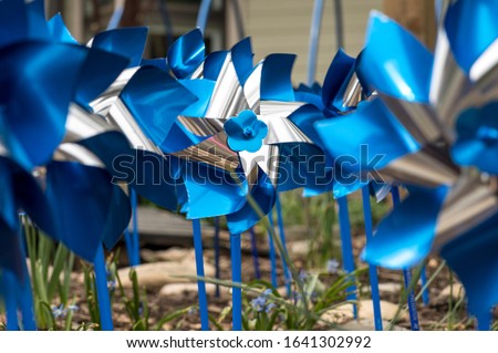 Shiny Blue and Silver Pinwheel Royalty-Free Stock Photo #1641302992