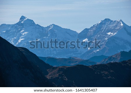 Evening idyllic autumn alpine scene. Peaceful Alps mountain view from hiking path from Dorfgastein to Paarseen lakes, Land Salzburg, Austria. Picturesque hiking seasonal, nature beauty concept scene.