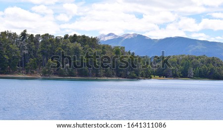 Beautiful landscape of mountains and lake, in town Bariloche in argentinian patagonia lake called Lago Nahuel Huapi, Argentina. 